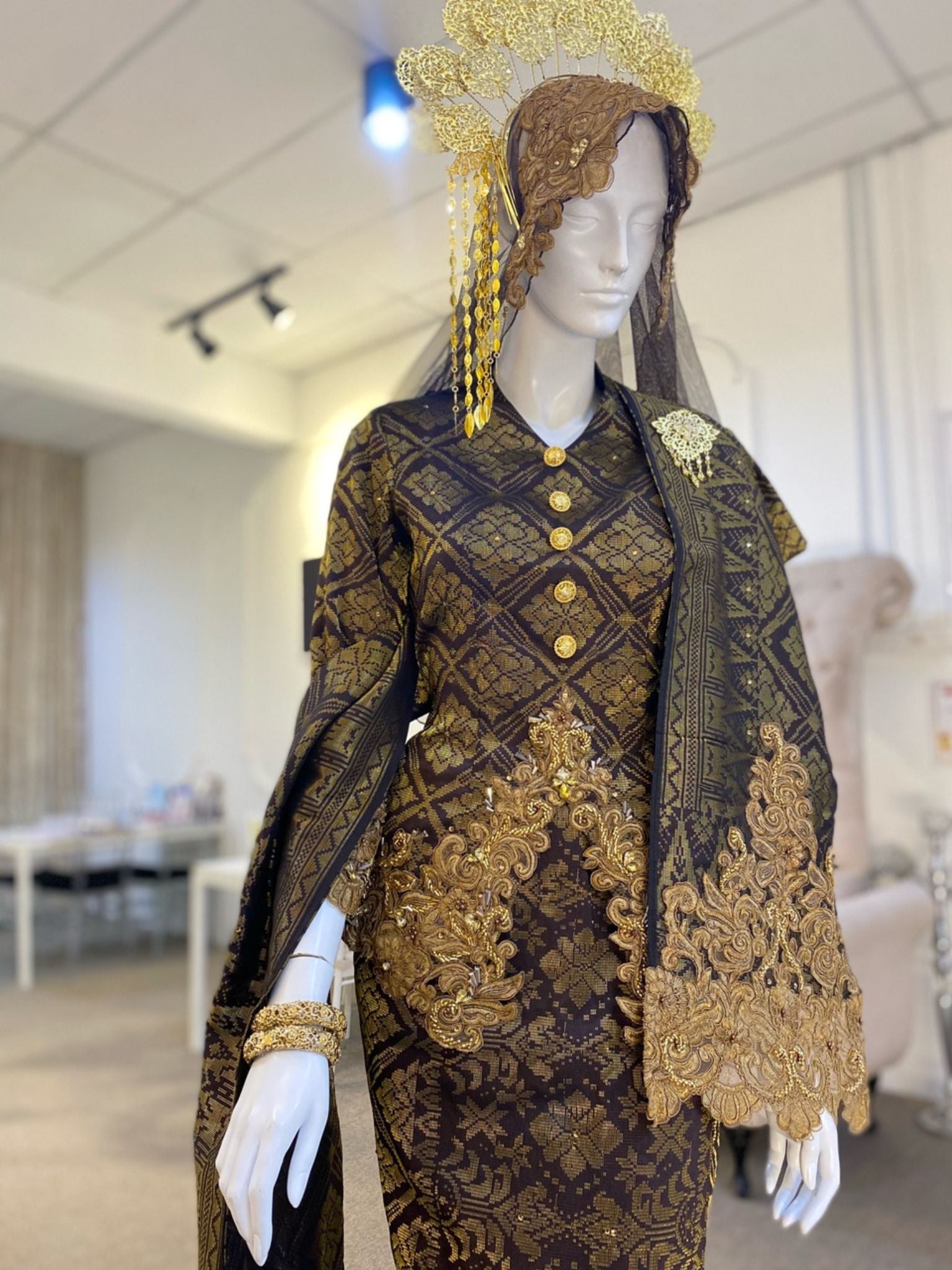 CENDANA - Baju Pengantin Kurung Pendek Dark Coco Brown and Gold Songket with Beaded Lace Detailing. Modern Traditional and elegant wedding dress with Dark Coco Brown and Gold songket fabric, featuring delicate beaded lace detailing on the bodice. Perfect for any Malay wedding. Available for rent in Malaysia and Singapore.