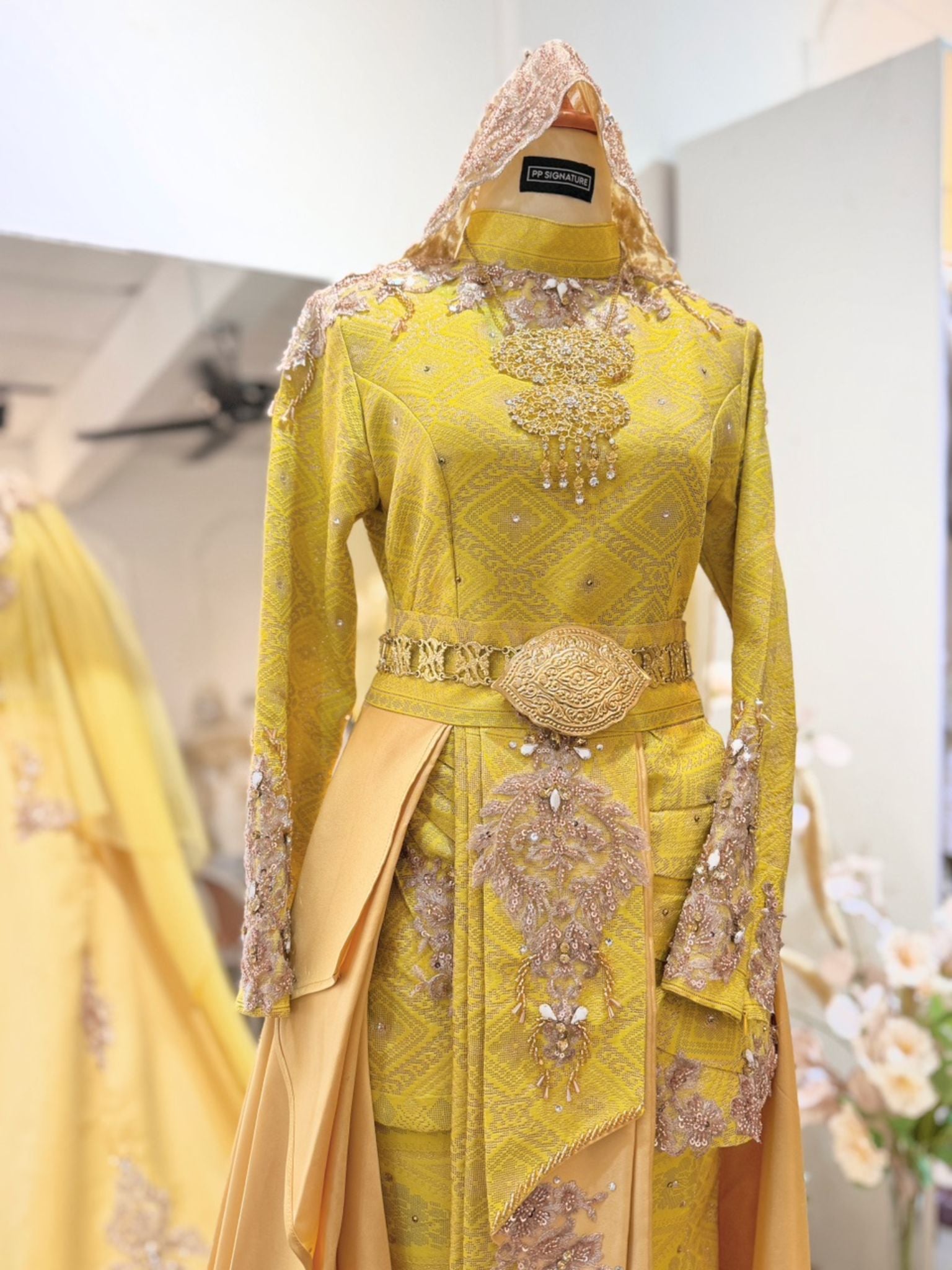 Make your wedding dreams a reality with PP Signature's TUN RAHAH - Baju Pengantin Yellow Champagne Songket Two-Piece Dress with Pants/Skirt and Detachable Trail Malay wedding dress rental.