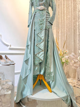 Crafted from premium quality Songket fabric, our CENDERAWASIH dress promises unparalleled comfort and luxurious feel. Designed with your comfort in mind, it ensures that you radiate confidence and grace throughout your wedding festivities. Rent CENDERAWASIH now and make your special day truly unforgettable.