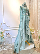 Indulge in elegance with our Sage Green Songket Two-Piece Dress. Crafted for comfort and style. Rent now for your perfect Malay wedding!