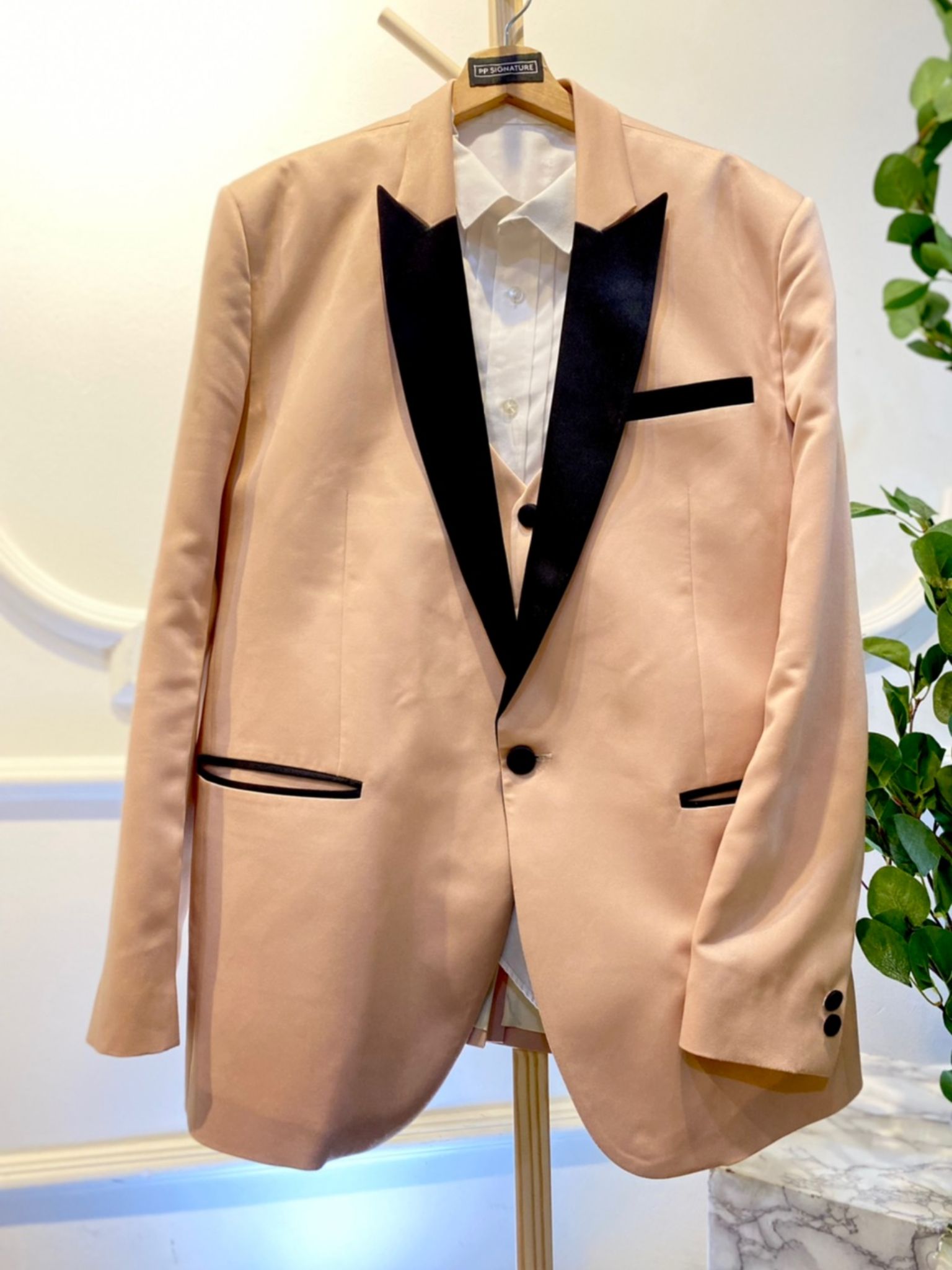 This Champagne 3 Piece Wedding Suit Light Brown with Black Peak lapel tuxedo jacket is the perfect choice for any formal occasion. Made from high-quality duchess fabric, it is both stylish and comfortable. The jacket features a classic single-breasted design with a peak lapel and satin trim. It also has two side pockets and one breast pocket. This jacket is available in a variety of sizes to fit all body types.