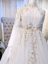 ELIZABETH  offers a mesmerizing ensemble for both bride and groom. Crafted from luxurious Duchess fabric with delicate lace detailing, the bride's attire features a stunning Ballgown design, while the groom can choose between a classic Suit or the intricate Kot Raihan Three-Piece ensemble. Available in sizes M to XL for both partners, this remarkable set is priced at MYR 850.00, down from RM1000.