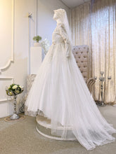 ELIZABETH  offers a mesmerizing ensemble for both bride and groom. Crafted from luxurious Duchess fabric with delicate lace detailing, the bride's attire features a stunning Ballgown design, while the groom can choose between a classic Suit or the intricate Kot Raihan Three-Piece ensemble. Available in sizes M to XL for both partners, this remarkable set is priced at MYR 850.00, down from RM1000.