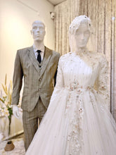 ELIZABETH  offers a mesmerizing ensemble for both bride and groom. Crafted from luxurious Duchess fabric with delicate lace detailing, the bride's attire features a stunning Ballgown design, while the groom can choose between a classic Suit or the intricate Kot Raihan Three-Piece ensemble. Available in sizes M to XL for both partners, this remarkable set is priced at MYR 850.00, down from RM1000.