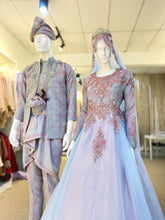Capture the essence of elegance with our ESKAYLA - Baju Pengantin Ballgown Songket Dusty Blue & Pink & Kot Raihan 3pcs. This exquisite ensemble combines traditional craftsmanship with contemporary design, showcasing the beauty of songket fabric in stunning dusty blue and pink shades. Perfect for a glamorous wedding, embrace the allure of this captivating ballgown and Kot Raihan 3pcs set.