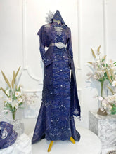 GEMAWAN Baju Pengantin Navy Blue Songket Dress with Selempang Sulam from Butik Pengantin PP Signature. This elegant wedding reception dress features Songket 3D fabric in navy blue with purple and light gold accents-pakej perkahwinan-baju pengantin-baju sanding-butik pengantin kajang-butik pengantin pp signature-planet pengantin