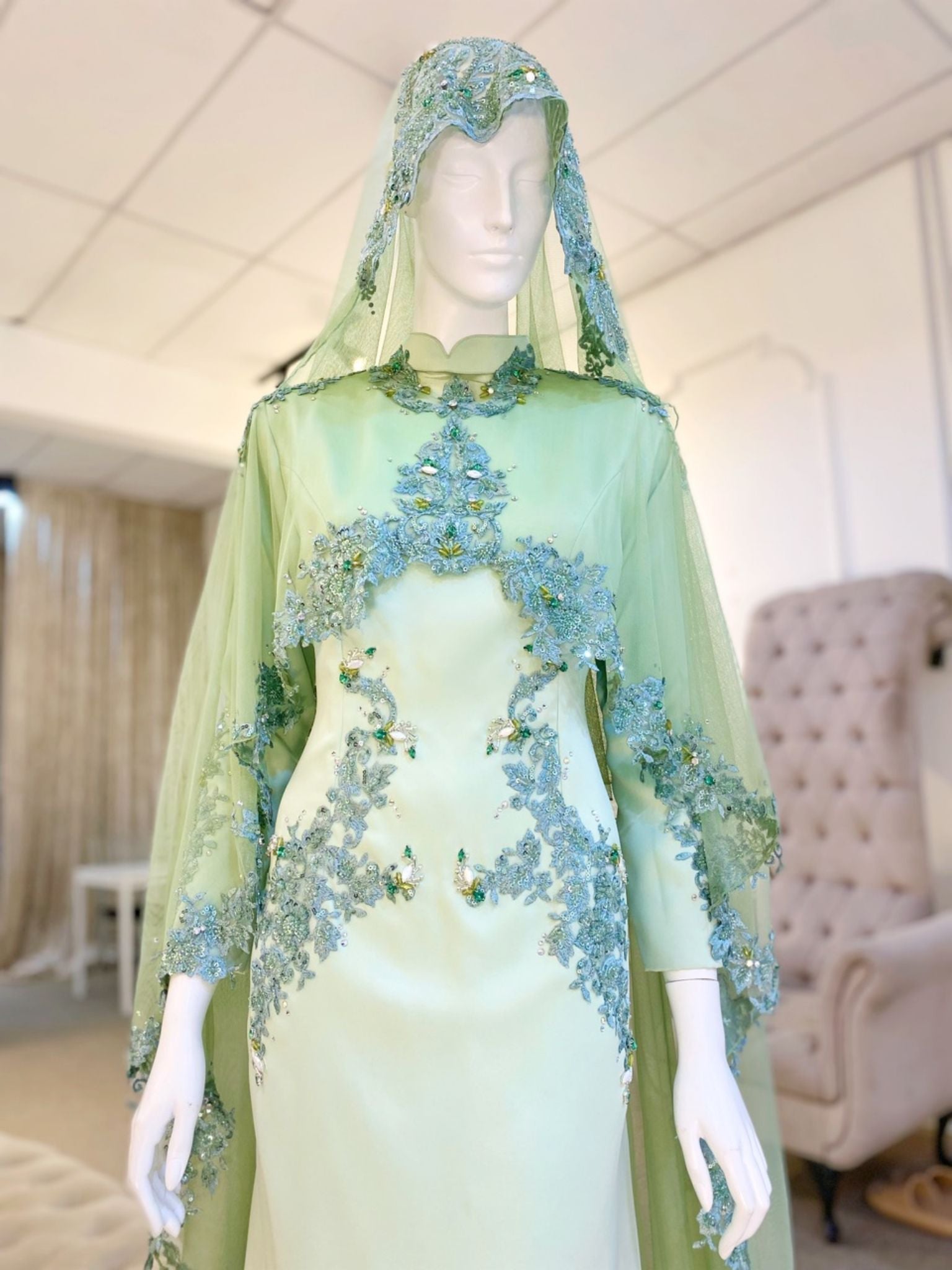 Hajar is an elegant olive green double face wedding dress with a detachable cape that is perfect for the modern bride. With its unique design and flattering fit, Hajar is sure to turn heads on your big day. Made from luxurious double face fabric, this dress is the perfect way to celebrate your special day in style.
