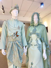 Hajar is an elegant olive green double face wedding dress with a detachable cape that is perfect for the modern bride. With its unique design and flattering fit, Hajar is sure to turn heads on your big day. Made from luxurious double face fabric, this dress is the perfect way to celebrate your special day in style.