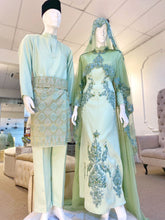 Hajar is an elegant olive green double face wedding dress with a detachable cape that is perfect for the modern bride. With its unique design and flattering fit, Hajar is sure to turn heads on your big day. Made from luxurious double face fabric, this dress is the perfect way to celebrate your special day in style.