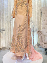 Explore our captivating collection featuring HUMAIRA - Baju Sanding in the elegant Salmon Peach color, exclusively from PP Signature Bridal. This Duchess A-cut wedding attire comes with a graceful trail, perfect for your special day. Discover the ultimate choice for renting bridal attire today!