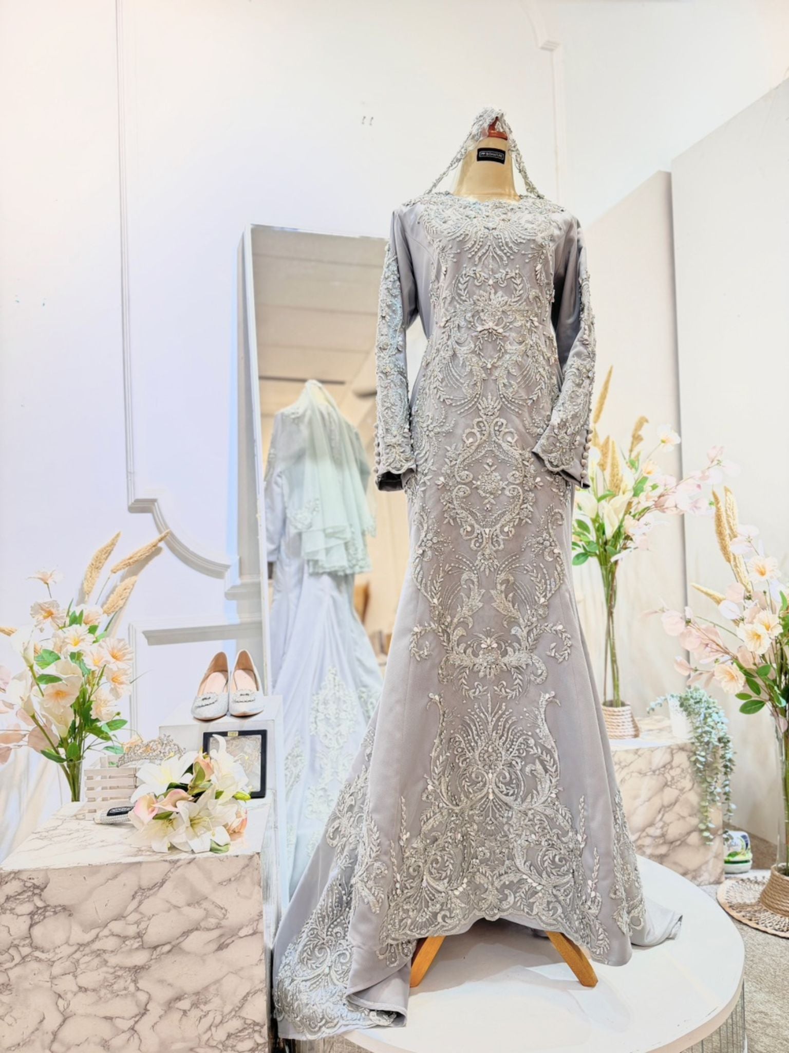 LUMIERE - Silver Grey Duchess Trumpet Dress with Lace - A stunning Baju Pengantin for Malay Weddings, featuring a trumpet dress design in elegant silver grey. Crafted from luxurious duchess fabric embellished with intricate lace detailing. Perfect for weddings and formal occasions.