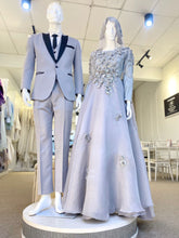 Madeleine is a stunning silver grey glitter lace ballgown muslimah dress that is perfect for the modern bride. With its elegant design and flattering fit, Madeleine is sure to turn heads on your big day. Made from luxurious glitter lace and organza, this dress is the perfect way to celebrate your special day.