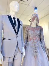 Matilda is a stunning silver grey and dusty pink ballgown muslimah dress that is perfect for the modern bride. Made from luxurious lace and organza, this dress is sure to turn heads on your big day. With its elegant design and flattering fit, Matilda is the perfect dress to make you feel confident and beautiful on your wedding day.