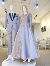 Matilda is a stunning silver grey and dusty pink ballgown muslimah dress that is perfect for the modern bride. Made from luxurious lace and organza, this dress is sure to turn heads on your big day. With its elegant design and flattering fit, Matilda is the perfect dress to make you feel confident and beautiful on your wedding day.