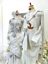 PALOMA Baju Pengantin Off White Songket Two-Piece Tulip Dress from Butik Pengantin PP Signature. Perfect for a wedding reception, featuring Songket 2D fabric and silver accents for a traditional yet elegant look.