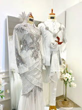 PALOMA Baju Pengantin Off White Songket Two-Piece Tulip Dress from Butik Pengantin PP Signature. Perfect for a wedding reception, featuring Songket 2D fabric and silver accents for a traditional yet elegant look.