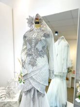 PALOMA Baju Sanding Off White Songket Two-Piece Tulip Dress from Butik Pengantin PP Signature, perfect for your pakej perkahwinan. Featuring premium Songket 2D fabric with silver accents for a classic wedding reception look.