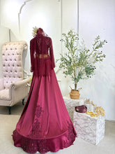 Back view of maroon songket Baju Pengantin with detachable trail and Puteri Perak detailing-Trailing kain with silver threadwork in traditional Baju Sanding Perempuan design