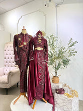 Puteri Manira Baju Pengantin maroon songket set for bride and groom in traditional Malay wedding look-Couple in matching Baju Sanding maroon songket with silver detailing for resepsi perkahwinan
