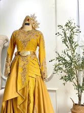 Close-up of Baju Pengantin top showing 3D songket texture and metallic gold detailing-Pakej Sanding