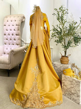 Back view of mustard gold songket Baju Pengantin with detachable trail and detailed pattern-Elegant train and back design of Puteri Perak-inspired songket bridal outfit-Pakej Kahwin