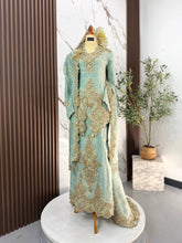 Gambar pasangan pengantin sebenar menggayakan baju sanding QALISYA songket 3D sage green light gold di majlis perkahwinan tradisional melayu