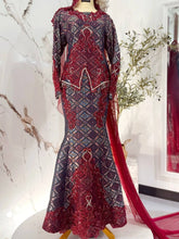 Close-up detail of RUBY maroon songket 3D dress with light pink accents and groom 3-piece kot raihan