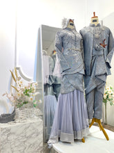 SALLY Baju Pengantin songket set in dark grey and silver for modern Malay bride and groom-Couple in coordinated grey Baju Sanding and Kot Raihan for elegant wedding reception