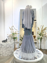 Back view of SALLY tulip dress with traditional songket weaving in dark grey and silver-Simple back silhouette of Baju Sanding Perempuan with classic 2D songket finish