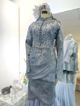 Top detail of Baju Pengantin Perempuan with tulip cut and metallic silver thread songket-Close-up of neckline and bodice in 2D songket with modern Malay bridal styling