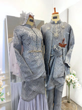 Close-up of grey songket outfits with tulip dress and traditional Kot Raihan for pengantin lelaki-Bride and groom in modern Baju Pengantin with silver accents and classic Malay accessories