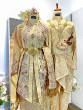 Close-up shot of the elegant songket fabric on the matching SRI ENONG Baju Pengantin