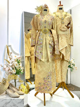 Full view of the SRI ENONG couple wearing baby pink songket Baju Sanding; bride in kebaya with selempang sulam and groom in Kot Raihan