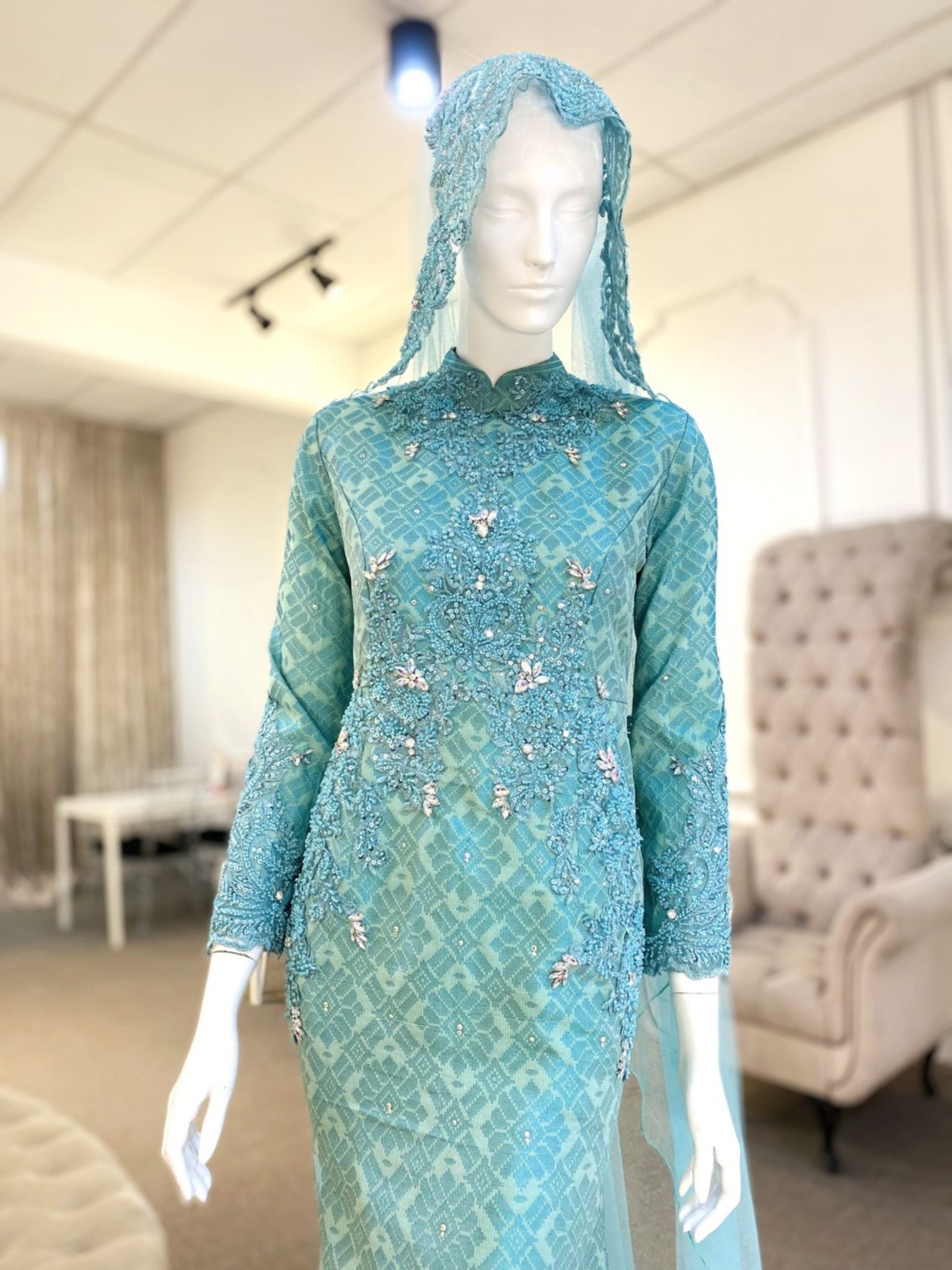 Tiffany is a stunning baby blue & turquoise songket 2D trumpet wedding dress that is perfect for the modern bride. With its elegant design and flattering fit, Tiffany is sure to turn heads on your big day. Made from luxurious songket 2D fabric, this dress is the perfect way to celebrate your special day.