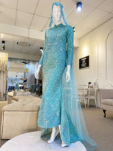 Tiffany is a stunning baby blue & turquoise songket 2D trumpet wedding dress that is perfect for the modern bride. With its elegant design and flattering fit, Tiffany is sure to turn heads on your big day. Made from luxurious songket 2D fabric, this dress is the perfect way to celebrate your special day.