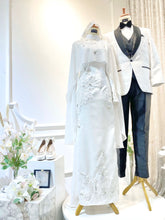 Introducing WARDAH's exquisite Baju Pengantin Off White Double Face Dress with Detachable Cape, priced at MYR 899.00. Tailored for the bride in sizes XS to M and the groom in sizes S to 2XL, both in a charming off-white hue. The bride's ensemble features a stylish dress with a detachable cape, while the groom dons the signature suit design. Crafted from premium double face material, this set, originally priced at RM1150, promises timeless elegance for your special day.