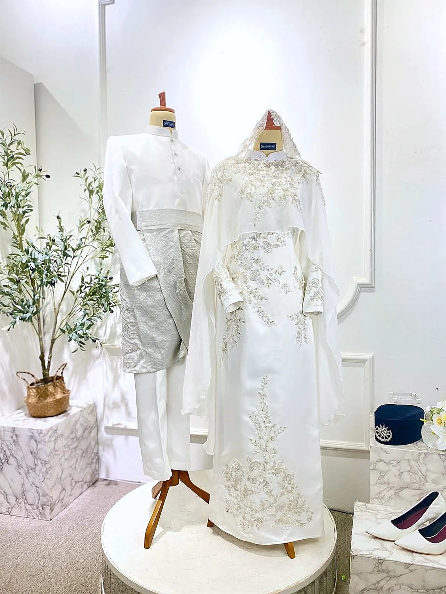 Malay bride and groom in coordinated Off White Baju Nikah from PP Signature Bridal-Soft Akad Nikah styling presented for Sewa Baju Nikah with satin dress and Baju