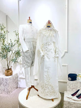 Malay bride and groom in coordinated Off White Baju Nikah from PP Signature Bridal-Soft Akad Nikah styling presented for Sewa Baju Nikah with satin dress and Baju
